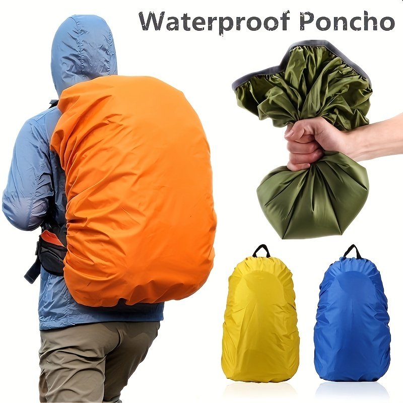 Orange hunting backpack rain cover stretched over a loaded pack in wet backcountry timber