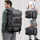 Charcoal tactical hunting backpack with red-accented MOLLE webbing and stacked front pockets