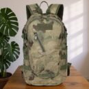 A-TACS FG camo hunting backpack with MOLLE webbing displayed in forest setting